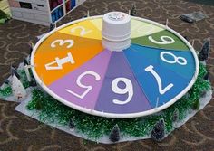 a colorful wheel of fortune sitting on top of a carpet