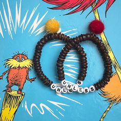 I just adore the Lorax- such a funky little environmentally conscious creature  Brown beads are all-natural coconut beads  Choose your truffula tree (Pom Pom charm) color from the drop-down in 'variations' Pre-made bracelets measure approximately 16cm *If you would like a different size, please leave it (in centimeters) in the personalization section All bracelets are double-threaded on strong and stretchy elastic string, secured with a surgeons knot and E6000 adhesive  Pre-made bracelets measure ~16cm (see last photo for reference) All pre-made bracelets can also be made to custom lengths upon request, as long as they are still in stock Lorax Bracelet, The Lorax Perler Bead, Lorax Plush, Lorax Stuffed Animal, Unless Lorax, Truffula Trees, Pom Pom Charm, The Lorax, Wildlife Conservation