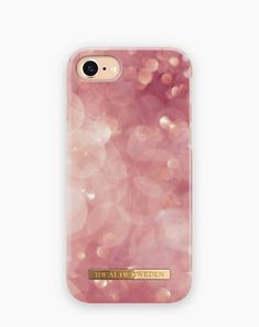 a pink phone case with gold foil on the front and back, that says total of sweden