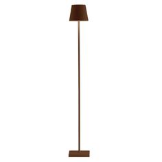 a floor lamp with a brown shade on it