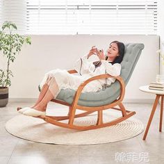 a woman sitting in a rocking chair taking a selfie