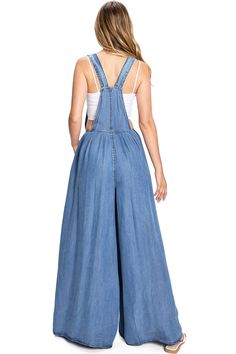 Super wide-leg tencel overalls with a single-pocket bib. Traditional clasps with adjustable straps. Fitted waist with a side seam zipper closure and pockets at the hip. Light-weight chambray material. CARE | Machine Wash Cold CONTENTS | 100% Tencel MEASUREMENTS | 40"/152 cm Top to Bottom 29"/74 cm Inseam (Size Small) MODEL | 5'8 - wearing a size Small IMPORTED Overalls Pink, Birthday Party Outfits, Evening Dress Fashion, Jumpsuit Fashion, Celebrity Dresses, Modest Dresses, Trendy Dresses, Wide Leg Trousers, Tulum