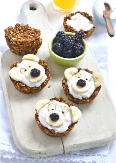 some fruit and yogurt treats are on a cutting board