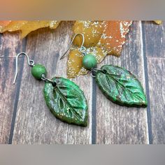 Pumpkin Leaf Dangle Earrings Polymer Clay & Natural Gaspeite Beads - Handmade Item Materials: Polymer Clay, Natural Gaspeite Beads 8mm, Clear Coat, Silver Plated Earring Hooks. Size: 60mm Long - New Each One Is A Unique All Hand Made - Color Product Photo On Your Monitor May Differ Slightly From The Original. Disney Princess Earrings, Pumpkin Leaf, Sterling Silver Heart Earrings, Princess Earrings, Pumpkin Leaves, Stick Earrings, Earrings Polymer, Bamboo Earrings, Silver Heart Earrings