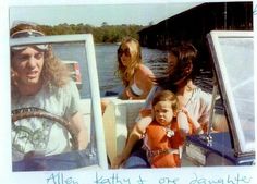 two women and a child are riding in a boat