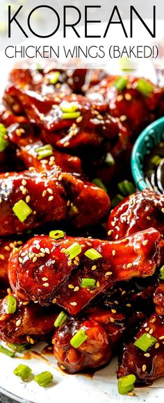 chicken wings with sesame seeds and sauce on a plate