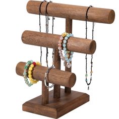 a wooden stand with bracelets hanging from it