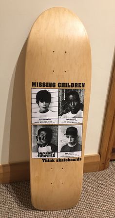 a wooden skateboard with missing children on it