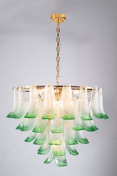 a chandelier with many green glass pieces hanging from it