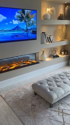 a large flat screen tv mounted on the wall above a fireplace