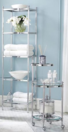 a bathroom with blue walls and white towels