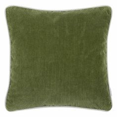 a green pillow with white piping