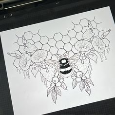 a drawing of a bee and honeycombs with flowers in the background on a piece of paper