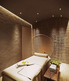 a massage room with a hammock chair and table