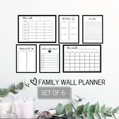 the family wall planner set of 6 is shown with candles and greenery in front of it