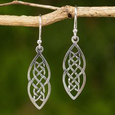 From Wadarat Supasirisuk in Thailand, these handcrafted earrings are beautiful. Sterling ribbons intertwine in classic Celtic braid motif. Sterling silver Hook earrings Combination finish Handmade in & fairly traded from Thailand Gordian Knot, Celtic Braid, Celtic Earrings, Layered Necklaces Silver, Fine Silver Jewelry, Silver Dangle Earrings, Silver Jewelry Fashion, Geometric Necklace, Sterling Silver Dangle Earrings