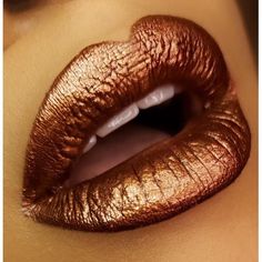 Creamy, Moisture-packed lipstick with EXTREME PIGMENT! Hurricane Amber is a chocolate copper lip shade that works as a sexy nude, or a subtle metallic pop! Black and Woman-Owned Indie Brand! Loudmouth Lip Attire is all about bringing color and fun back into beauty! We offer small batch, handcrafted cosmetics that are made with natural ingredients. All of our products are gluten-free, cruelty-free and chemical free! Our products are therapeutic for your skin, and are safe enough to use on lips, f Bronze Lipstick Copper, Copper Lipstick Lip Colors, Gold Lipstick Black Women, Copper Lipstick, Lip Ideas, Bronze Lipstick, Bronze Lips, Eva Miller, Storybook Cosmetics