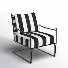 a black and white striped chair sitting on top of a metal frame