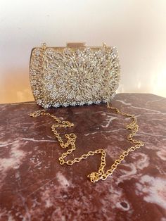 "Gold and Crystal Formal purse, Box purse, Wedding, Event, formal evening Converts to a clutch snap closure Lined interior PLEASE SEE MEASUREMENTS Measures: W 7\" x H 4 1/2\" x Depth 2\" Strap Drop 19\" Free shipping in the US 416+BX Gold and Crystal Formal purse, Box purse, Wedding, Event, formal evening" Gold Prom Purse, Elegant Rectangular Coin Purse For Formal Occasions, Elegant Compact Evening Bag For Formal Occasions, Elegant Formal Rectangular Coin Purse, Elegant Rectangular Formal Coin Purse, Elegant Compact Evening Bag For Party, Gold Clutch Openable For Party, Elegant Compact Evening Bag, Elegant Compact Clutch For Parties