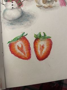 a drawing of strawberries and snowmen on a piece of paper