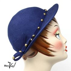 "Vintage Dark Blue Felt Hat - Haverhill Bradford Corp - Stud Trim - Hey Viv  * Special Feature: This spiffy hat has a front brim with a band of felt that is studded and finished with a bow on each side.  * Material: probably wool felt  * Measurement:     * The back of the hat is open so it should adjust to fit most     * Height: 3\"     * Brim: 2\"  * Stamped inside hat: Haverhill Bradford Corporation This item is in overall very good vintage condition consistent with its age. The top of the bri Luxury Navy Short Brim Hat, Luxury Blue Hat With Short Brim, Cheap Retro Blue Hats, Small Moths, Pillbox Hat, Vintage Hats, Beautiful Hats, Felt Hat, Hats Vintage