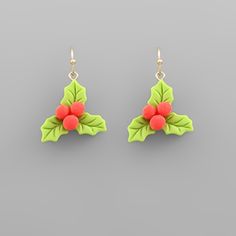 pair of green and red earrings with holly leaves