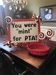 a sign that says you were mint for pta on top of some lollipops