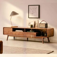 a living room with a large wooden entertainment center in it's centerpieces