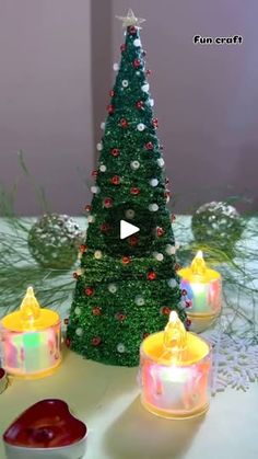 a christmas tree made out of candles on a table