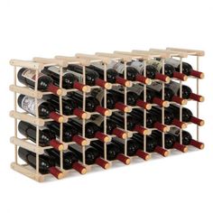 a wooden wine rack filled with lots of bottles