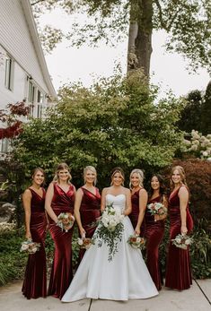 the bride and her bridesmaids pose for a photo