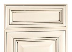 a white cabinet door with square and rectangle designs on the front, in an open position