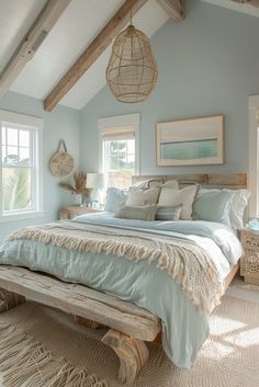 a bedroom with blue walls and wooden beams