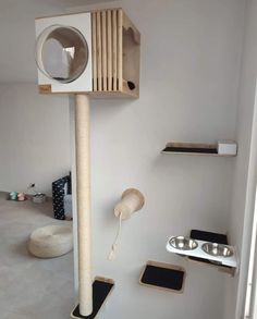 a cat tree in the middle of a room