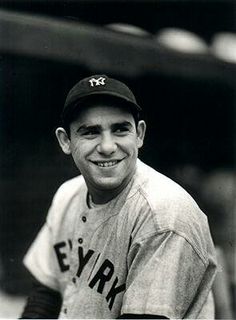 a black and white photo of a baseball player with a smile on his face,