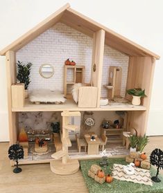 a doll house with furniture and decorations on the floor