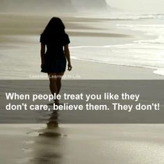 a woman walking on the beach with a quote about people treat you like they don't care, believe them they don't