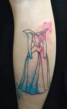 a woman's leg with a dress tattoo on the left side of her arm