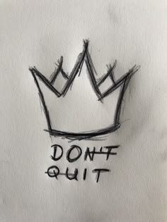 a drawing of a crown with the words don't quit written on it in black ink