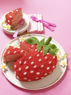 there is a strawberry cake on the plate