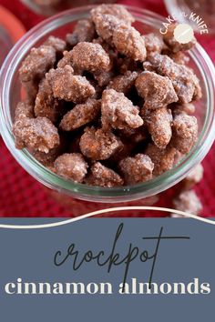 a bowl filled with crockpot cinnamon almonds on top of a red cloth