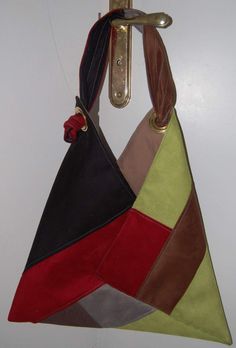 a multicolored purse hanging from a hook