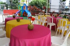 colorful tables and chairs are set up for an event