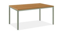 a wooden table sitting on top of a white floor