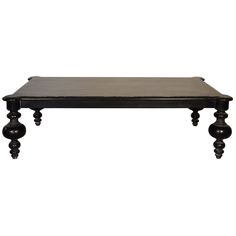 a wooden table with two black legs