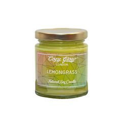 a jar of lemongrass scented candle on a white background