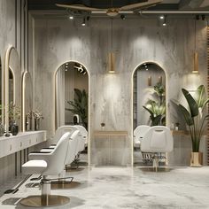 the interior of a hair salon with white chairs and mirrors on the wall, plants in vases