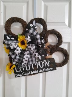 a dog door hanger with sunflowers on it