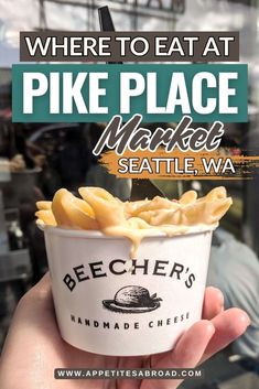 a person holding up a bowl of food with the words where to eat at pike place market seattle wa