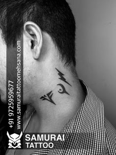 a man with an eye tattoo on his neck and behind his ear is the words samurai tattoo